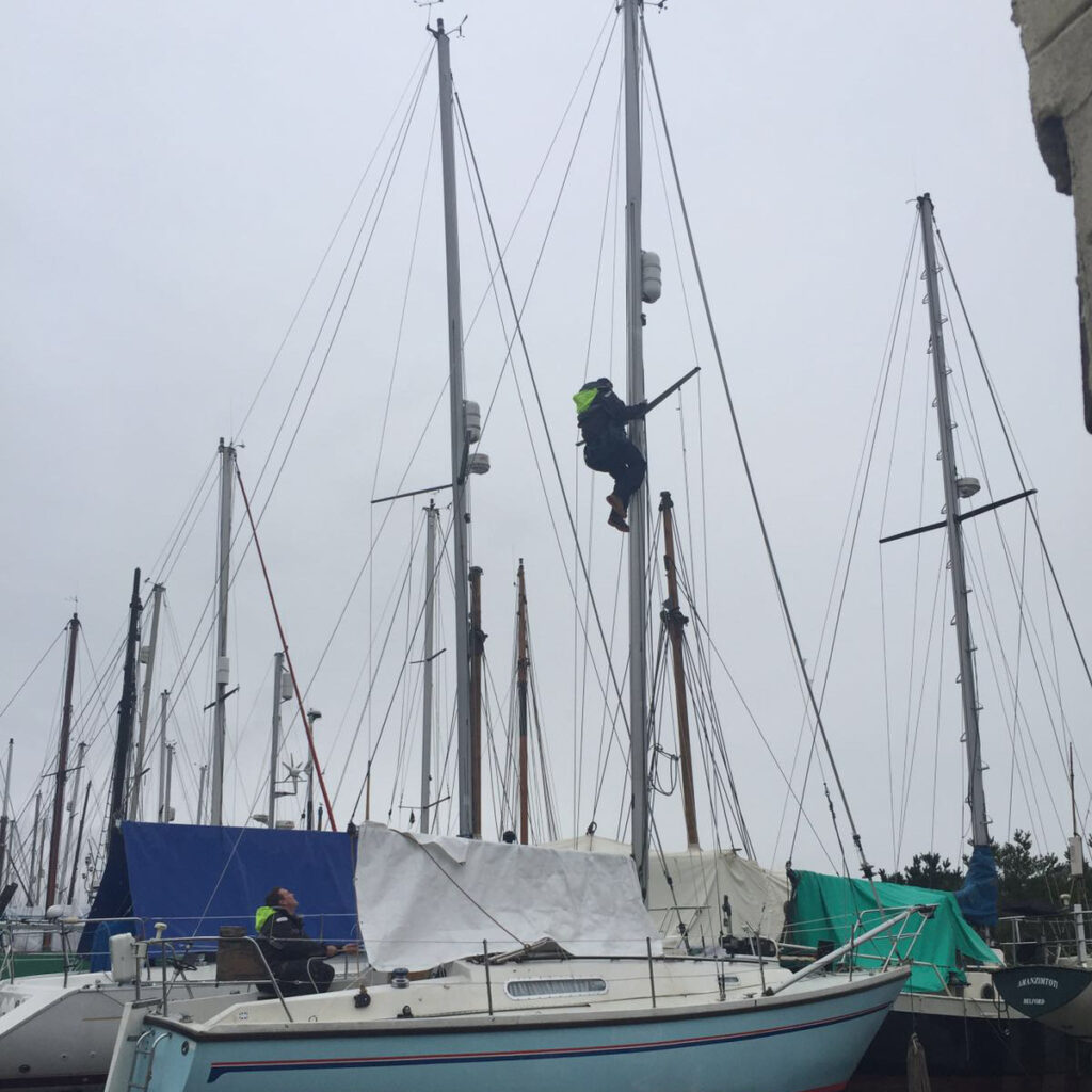 image of rigger working on sadler yacht in Falmouth